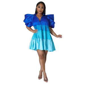 Detail view of the V-neck ombré blue satin tiered mini dress with puff sleeves.