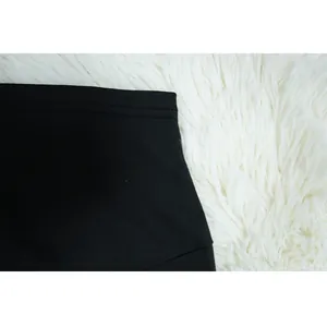 High-quality close-up of black sleeveless leisurewear waistband stitching detail