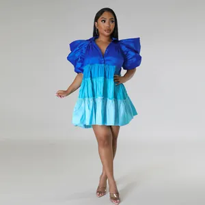 Full view of blue tiered satin mini dress with puff sleeves and color-blocking detail