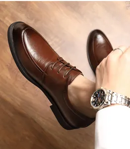 Close-up of elegant brown leather business shoes with hand-textured finish