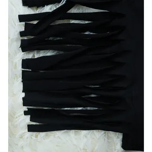Detailed close-up showing the soft texture and black fringe tassels of this casual set