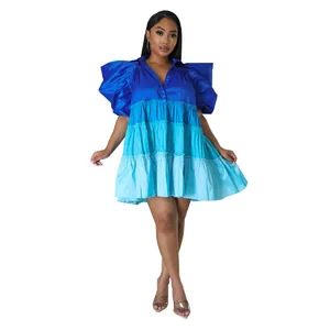 Detailed view of a V-neck tiered color-block satin dress featuring large puff sleeves