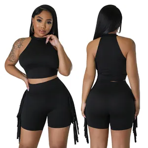 Front and back view of a black sleeveless crop top and fringe shorts two-piece set