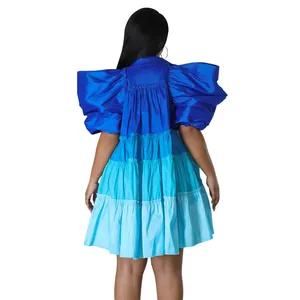 Back view of blue tiered satin mini dress with dramatic puff sleeves and A-line silhouette