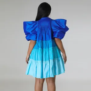 Back view of blue tiered satin mini dress with voluminous puff sleeves