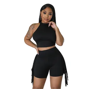 Sexy black two-piece set with sleeveless halter crop top and fringe shorts for women