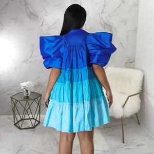 Detailed rear view of a gradient blue tiered satin mini dress with puffed sleeves