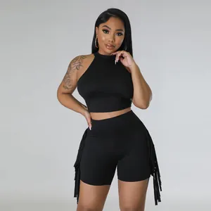 Sleeveless black two-piece leisure outfit featuring a mock neck top and fringe shorts.