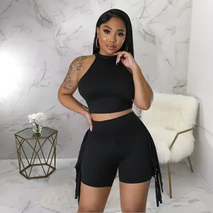 Stylish women's black sleeveless mock neck crop top with matching fringe shorts two-piece set