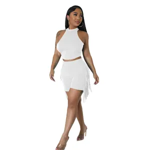 Full view of a white sleeveless crop top and fringe shorts two-piece set