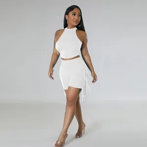 Sleeveless white crop top and shorts two-piece set featuring stylish side fringe detail