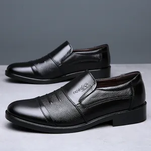 Detailed close-up of men's black leather business loafers featuring soft texture and sport logo