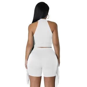 Back view of white fringe two-piece set with sleeveless top and high waist shorts
