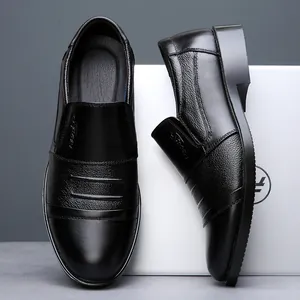Detailed view of premium black genuine leather men's slip-on business dress shoes.