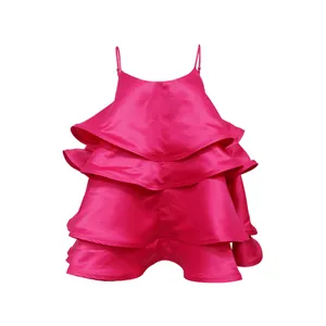 Detailed view of vibrant fuchsia satin tiered ruffle camisole top with thin straps