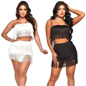 Sexy two-piece fringed set including a crop top and mini skirt in black and white colors