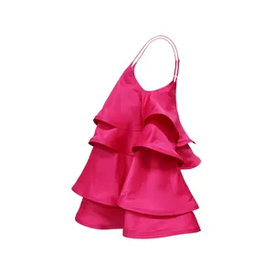 Detailed macro view of bright pink tiered satin camisole dress featuring elegant layered ruffles