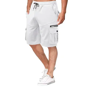 Men's white cotton cargo shorts with functional multi-pocket design shown on model