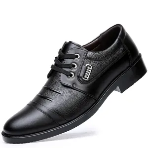 Side view detail of men's black genuine leather cap toe business formal dress shoes.
