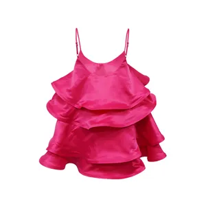 Hot pink satin tiered ruffled camisole dress with adjustable spaghetti straps detail.