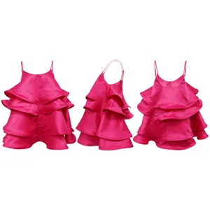 Detailed view of hot pink tiered satin camisole dress showing front side and back angles