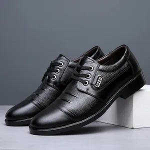 Close-up view of black genuine leather men's business dress shoes with lace-up design