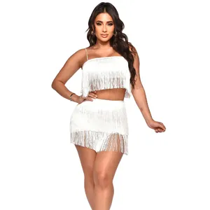 Detailed view of a white fringe two-piece nightclub set with crop top and mini skirt