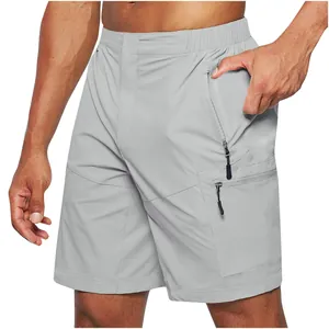 Detailed view of grey men's cargo shorts featuring functional side zipper pockets design