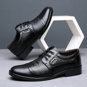 Close-up of black leather business dress shoes with lace-up detail and soft texture