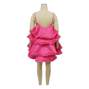 Detailed back view of a fuchsia pink satin tiered ruffled camisole mini dress on mannequin.