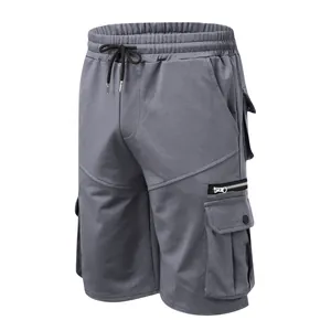 Close-up of grey men's cargo shorts with elastic drawstring waist and multi-pockets