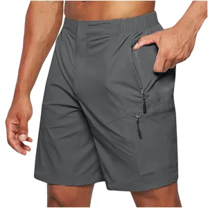 Detail view of gray men's cargo shorts with functional zipper pockets for outdoor utility.