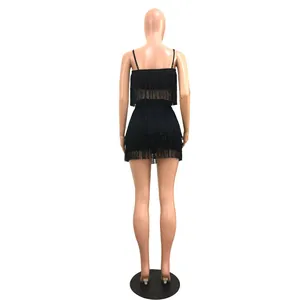 Detailed back view of a sexy black fringe two-piece set with a crop top and mini skirt.