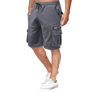 Detailed view of men's gray cotton cargo shorts with multiple pockets and drawstring waist