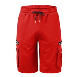 Men's red cotton cargo shorts with drawstring waist and multi-pocket design detail