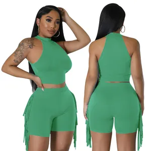 Front and back view of a trendy green sleeveless crop top and fringe shorts two-piece set