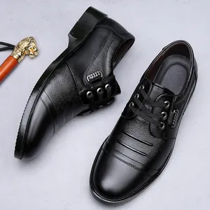 Detailed view of black genuine leather men's dress shoes with lace-up cap-toe design