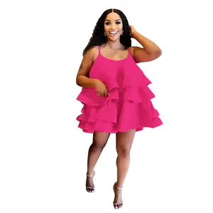 Front view of a hot pink tiered ruffled mini dress featuring thin spaghetti straps.