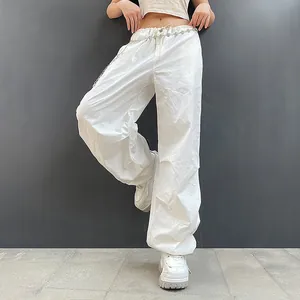 Trendy women's white baggy cargo pants with drawstring waist and chain belt accessory