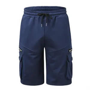 Close-up of navy blue men's cargo shorts with drawstring waist and zip pockets.