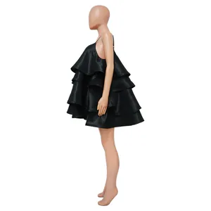 Detailed side view of a black satin tiered ruffle mini dress displayed on a mannequin.