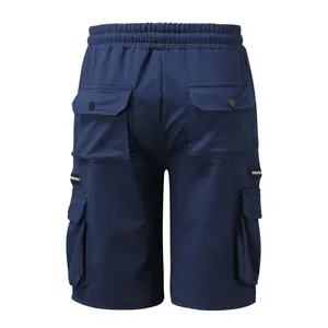 Close-up of navy blue cargo shorts with functional back pockets and side zippers