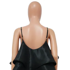 Back view detail of black satin spaghetti strap dress with ruffled tiered design.