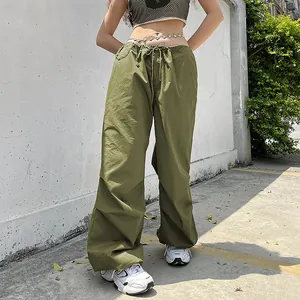 Close-up of olive green cargo pants showing the loose fit and drawstring waist detail