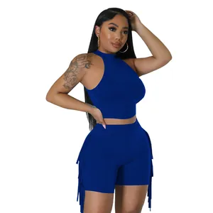 Detail of royal blue sleeveless two-piece outfit featuring side tassels for women.