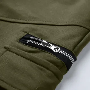 Detail macro view showing the durable silver metal zipper on men's olive cotton cargo shorts