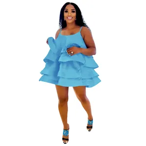 Detail view of a light blue tiered satin mini dress with spaghetti straps and U-neck.