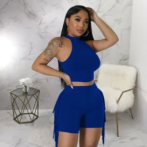 Detail view of royal blue two-piece set featuring sleeveless top and fringe shorts.