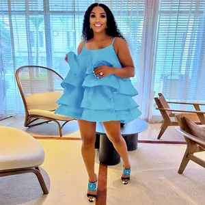 Bright blue satin mini dress with U-neck and tiered ruffles worn by a fashion model.
