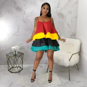 Detail of colorful tiered satin mini dress with U-neck and spaghetti straps